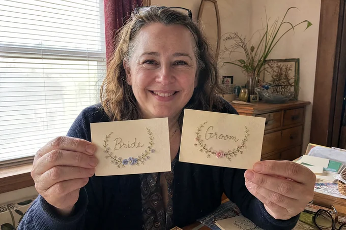 Karen M. with her finished paper-embroidery