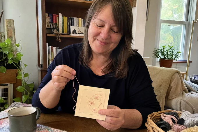 Sofia L. with her finished paper-embroidery